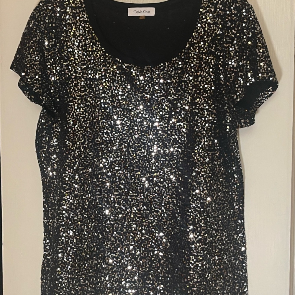 Calvin Klein black with silver sequin short sleeve tee shirt. Women’s large.